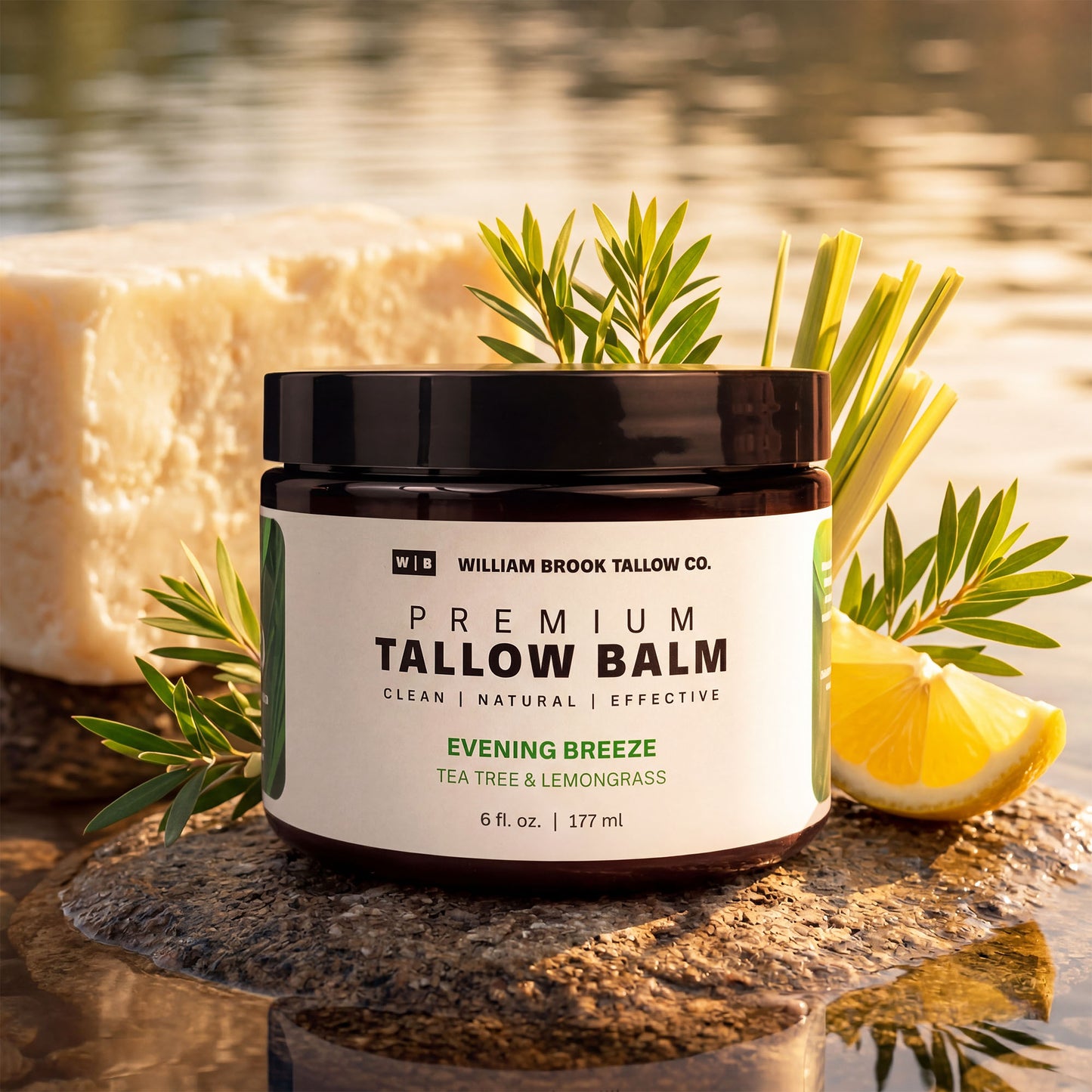 Jar of William Brook Tallow Co. Premium Tallow Balm with natural elements on a reflective surface